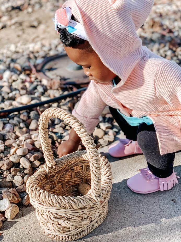 Toddler Playing With Rocks Outside